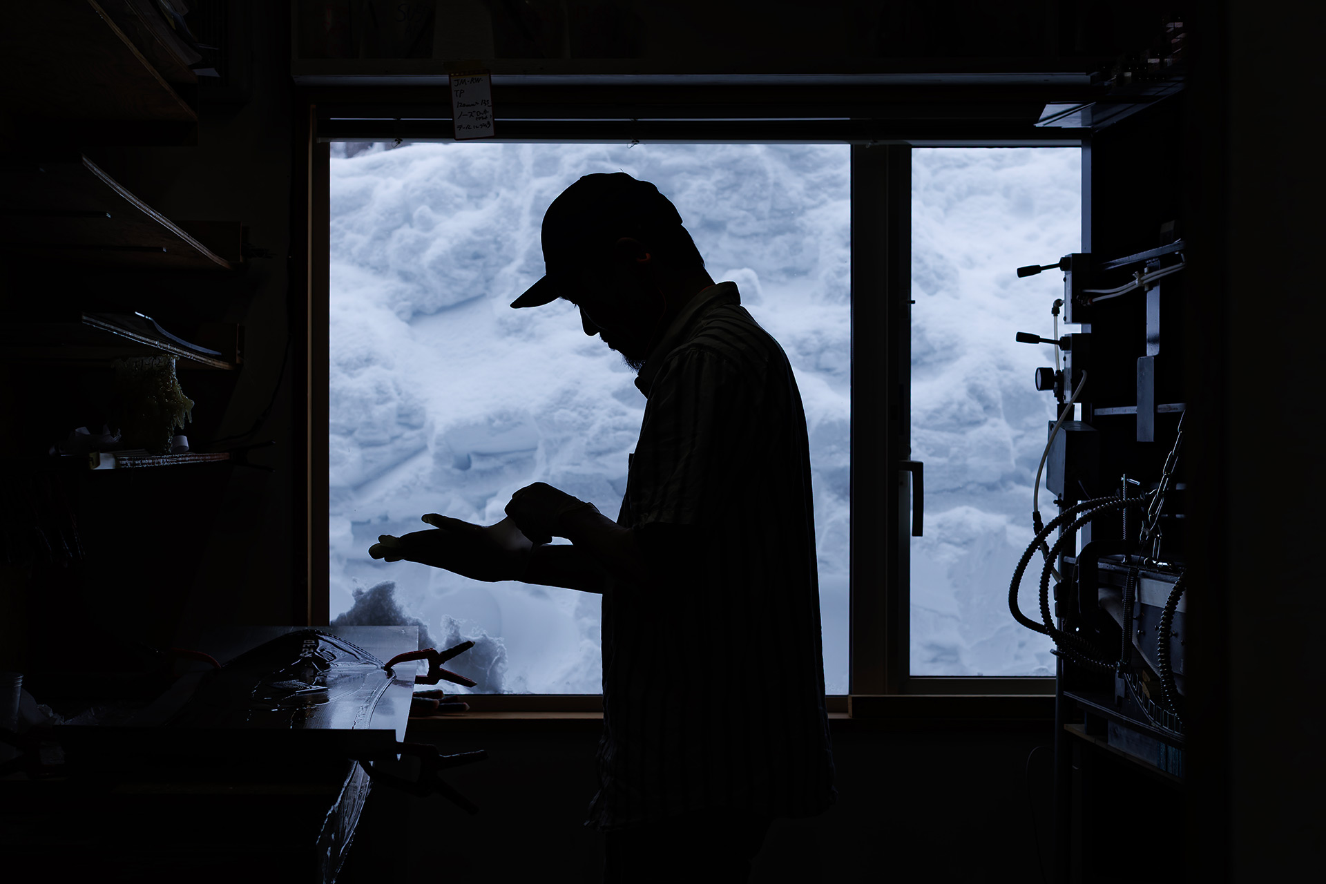 Tomohito Yamazaki shaping a snowboard in the Offshore workshop