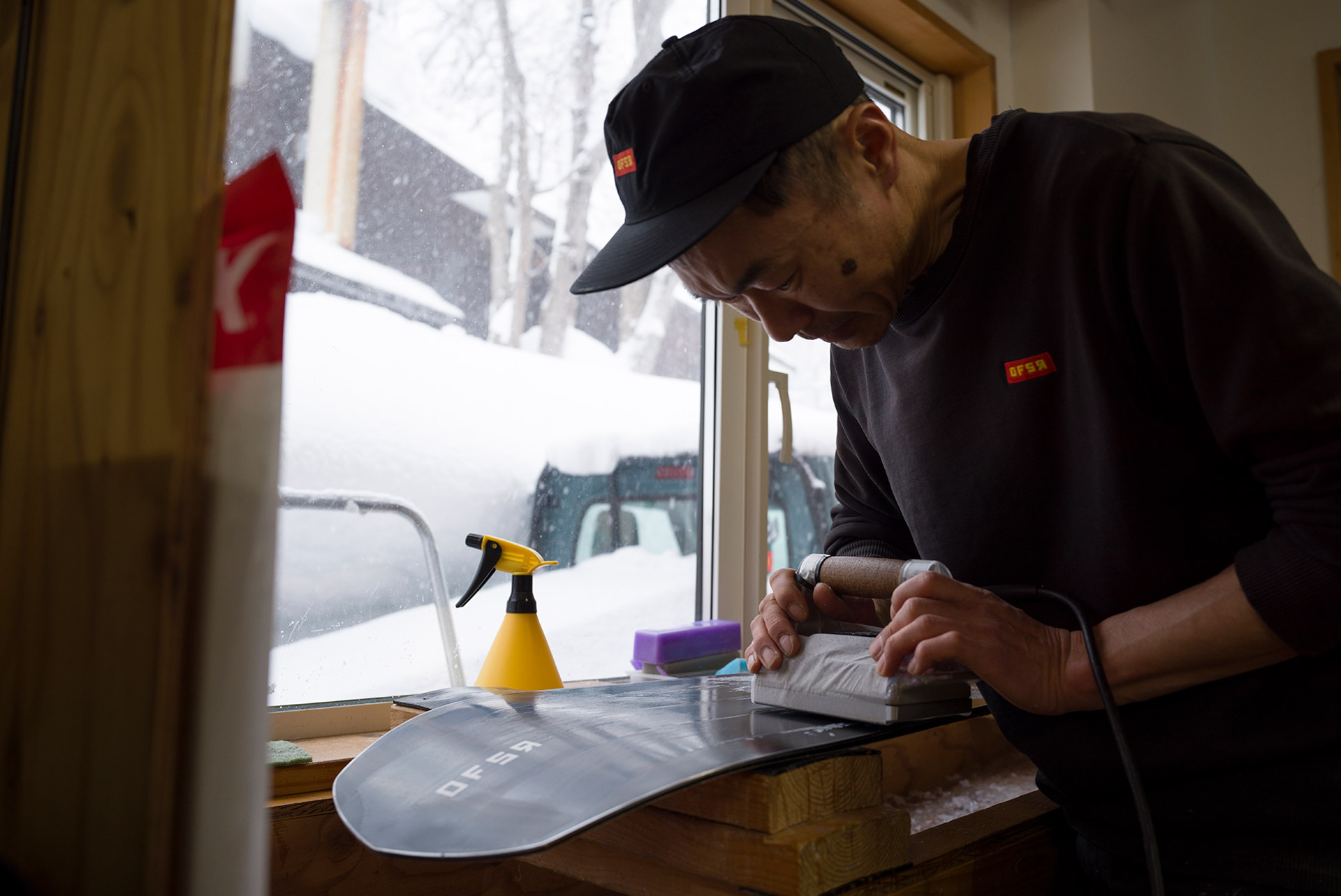 Waxing a finished board at the window bench