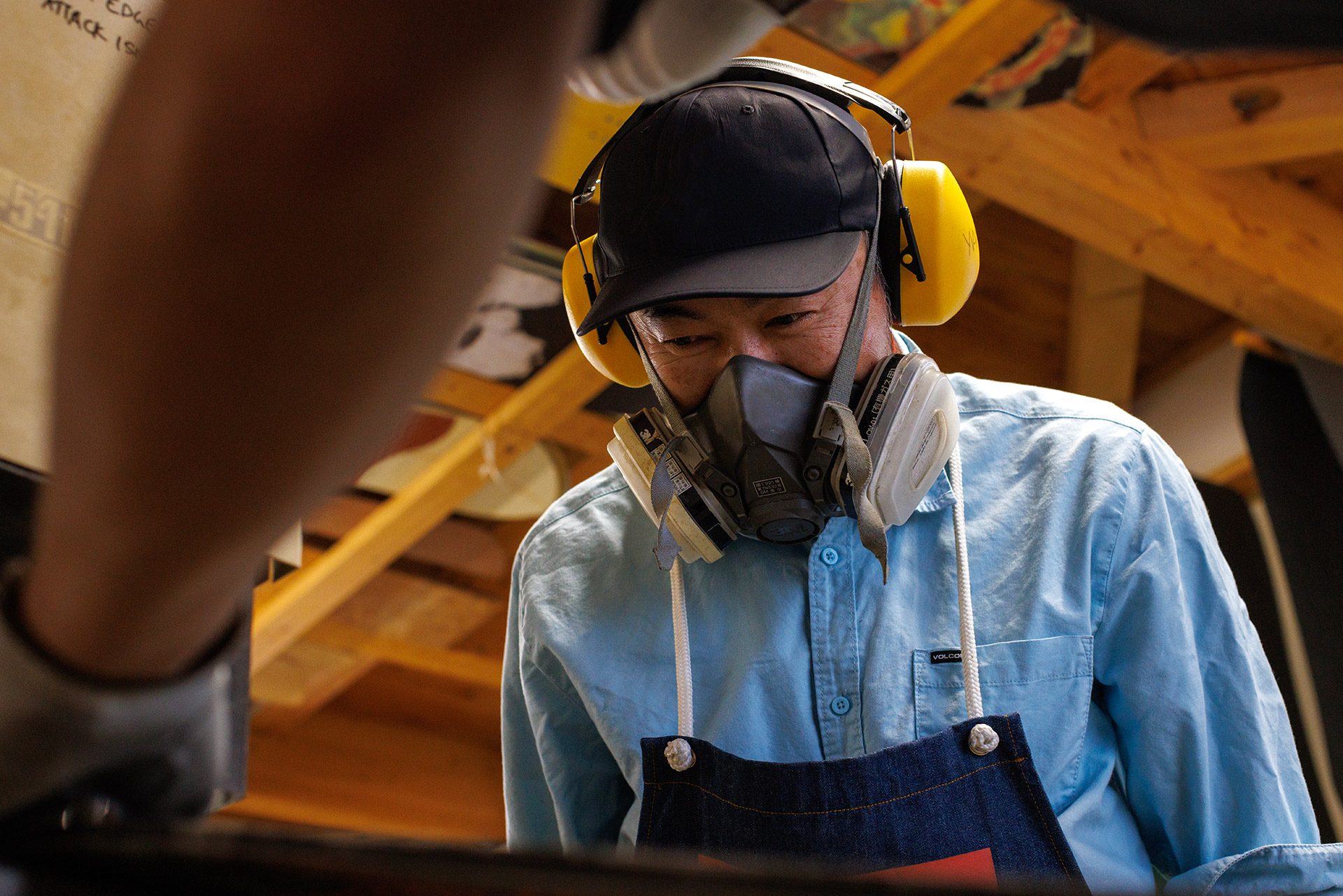 At the grinder, masked up