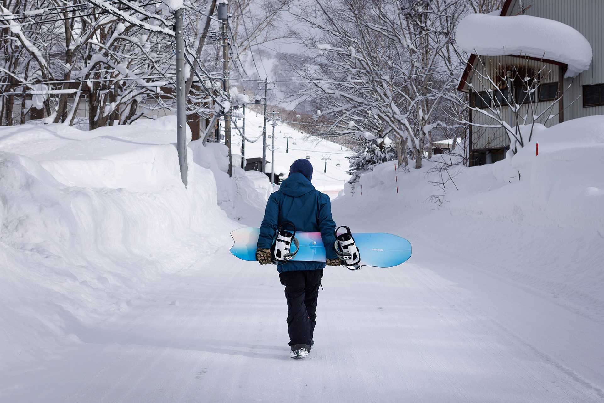Walking to the lifts with a board under the arm